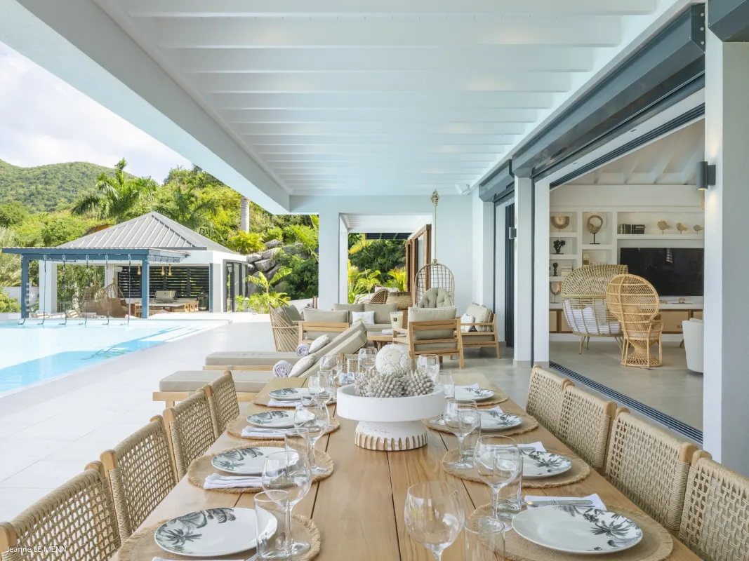 Villa Abaca: Covered terrace with a long dining table, lounge seating, and swimming pool
