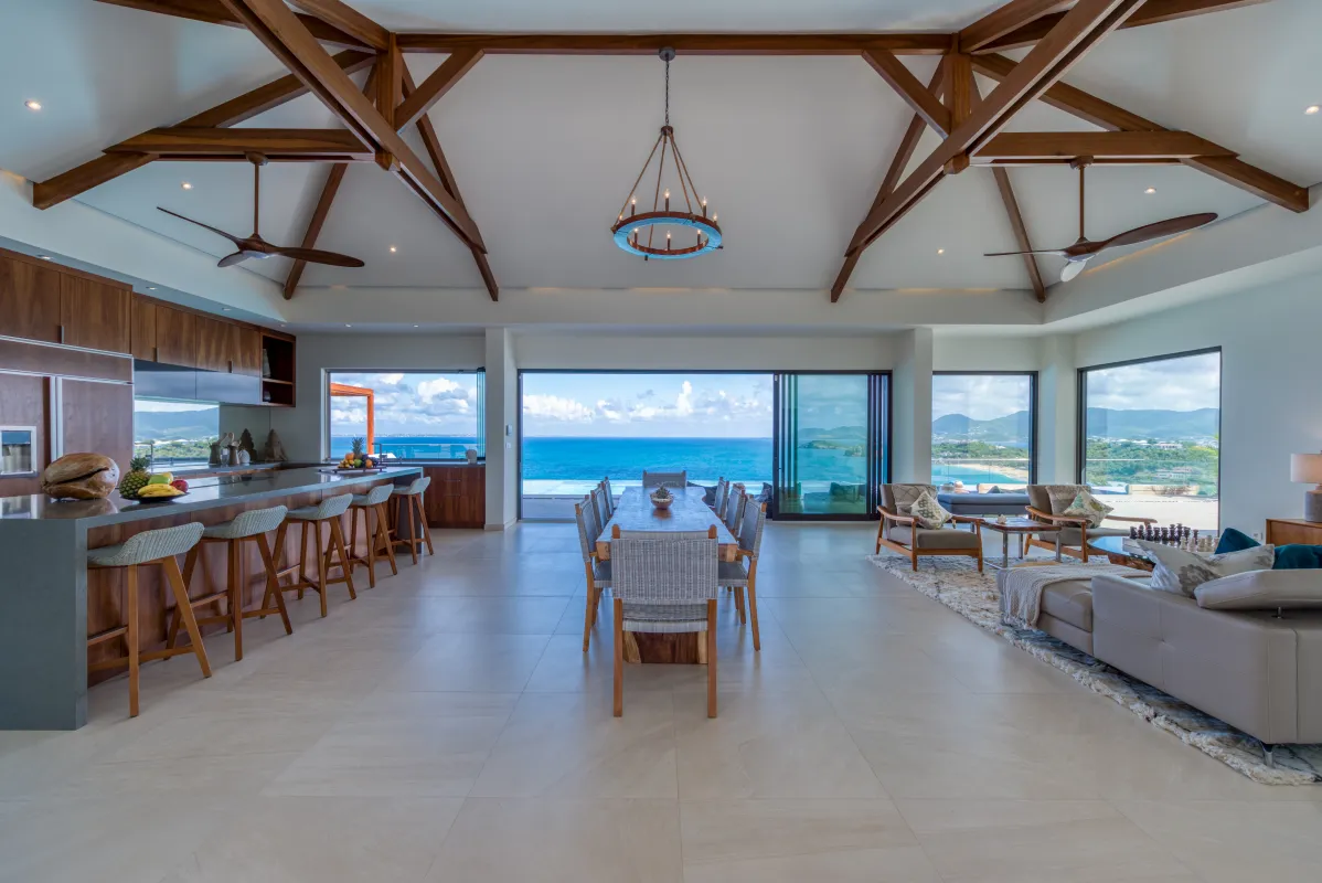 Villa Amandara: Open-concept living and dining area with high vaulted ceilings and ocean views