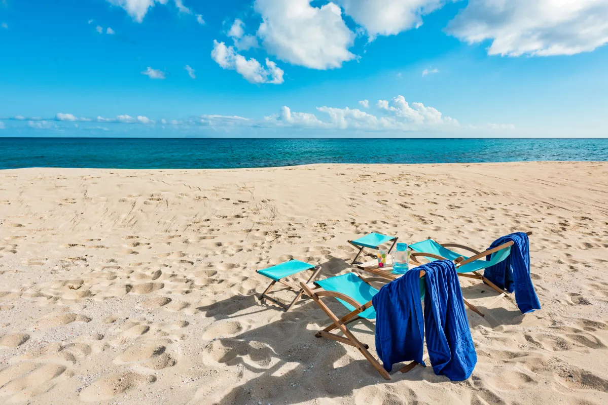 Villa Casa de la Playa: Folding beach chairs and a small table set up on the sand facing the ocean