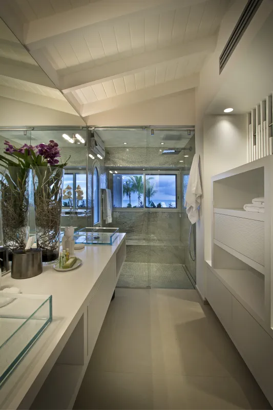 Villa C'est la Vie: Modern bathroom vanity with glass vessel sinks and walk-in shower with sea view