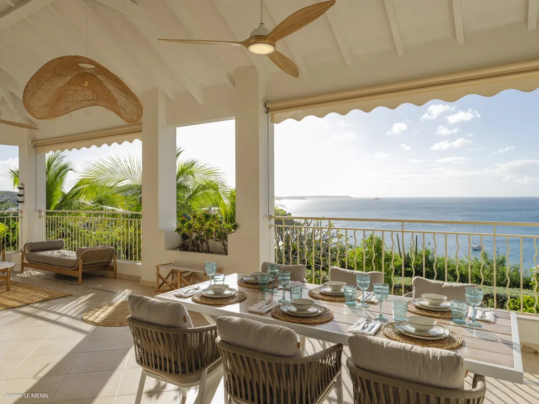 Villa Chez Paulette: Covered terrace with outdoor dining table set for a meal overlooking the sea