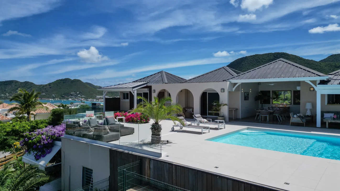 Villa Dreamin Blue: Swimming pool and spacious terrace outside a villa with lush mountain and sea views