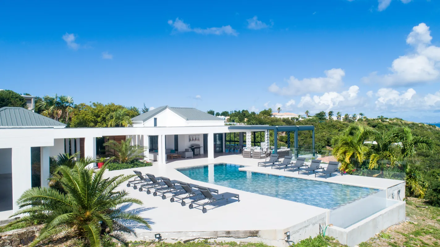 Villa La Siesta: Swimming pool and sun loungers on a wide terrace beside a white modern villa