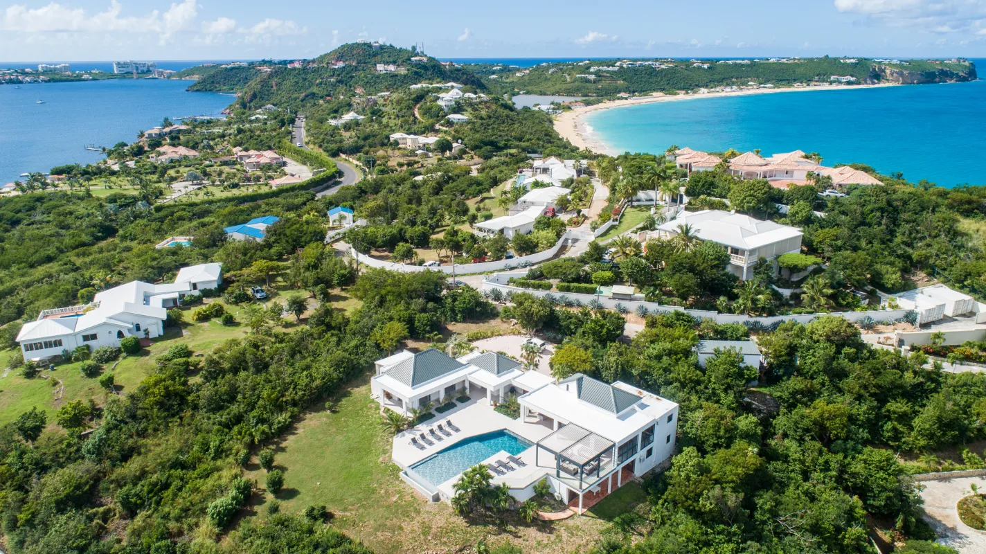 Villa La Siesta: Aerial view of the villa with a swimming pool overlooking the coastline and sea