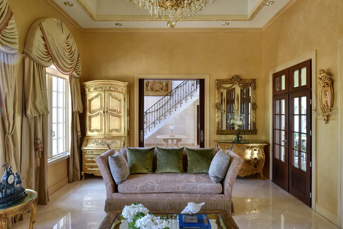 Villa Le Chateau Des Palmiers: Opulent living room with ornate gilded furniture and a sofa facing a coffee table