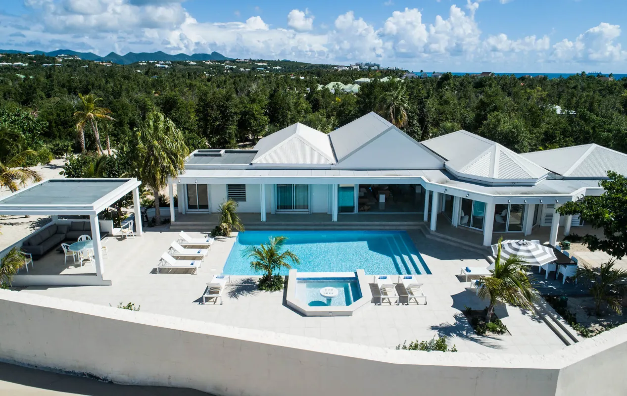 Villa L'Ecume des Jours: Aerial view of a white villa with a swimming pool, sun terrace, and gazebo