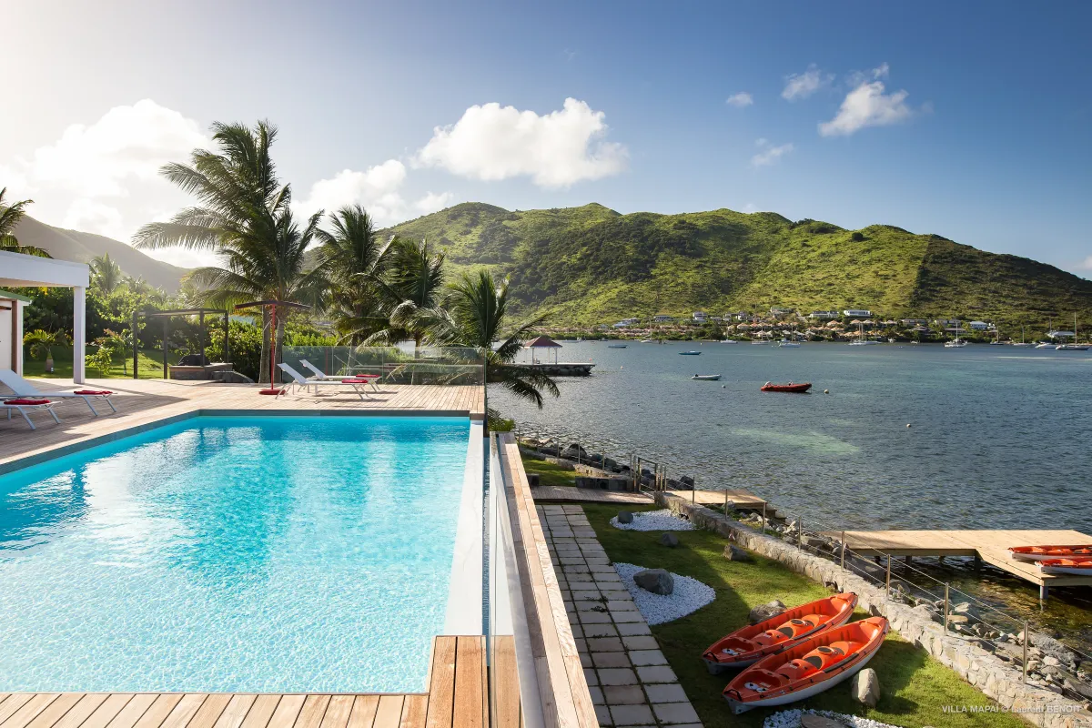 Villa Mapai: Swimming pool on a wooden deck overlooking a bay and green hills