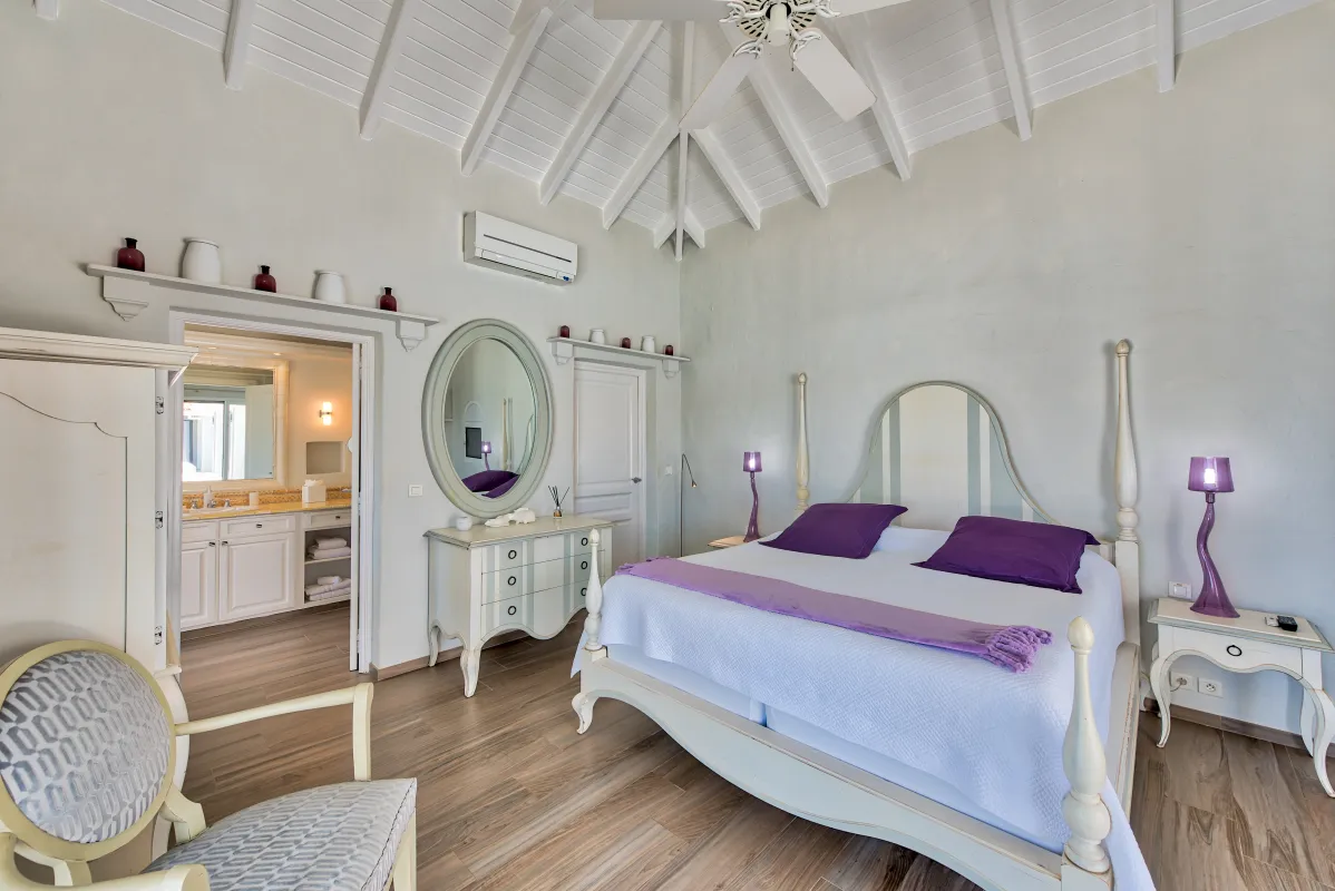 Villa Mirabelle: Bright bedroom with a vaulted ceiling, king bed, and adjoining bathroom