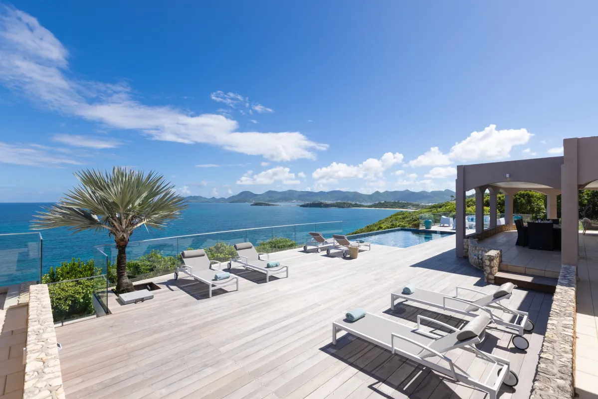 Villa Mongoose Run: Spacious wooden sun deck with lounge chairs and pool overlooking the ocean