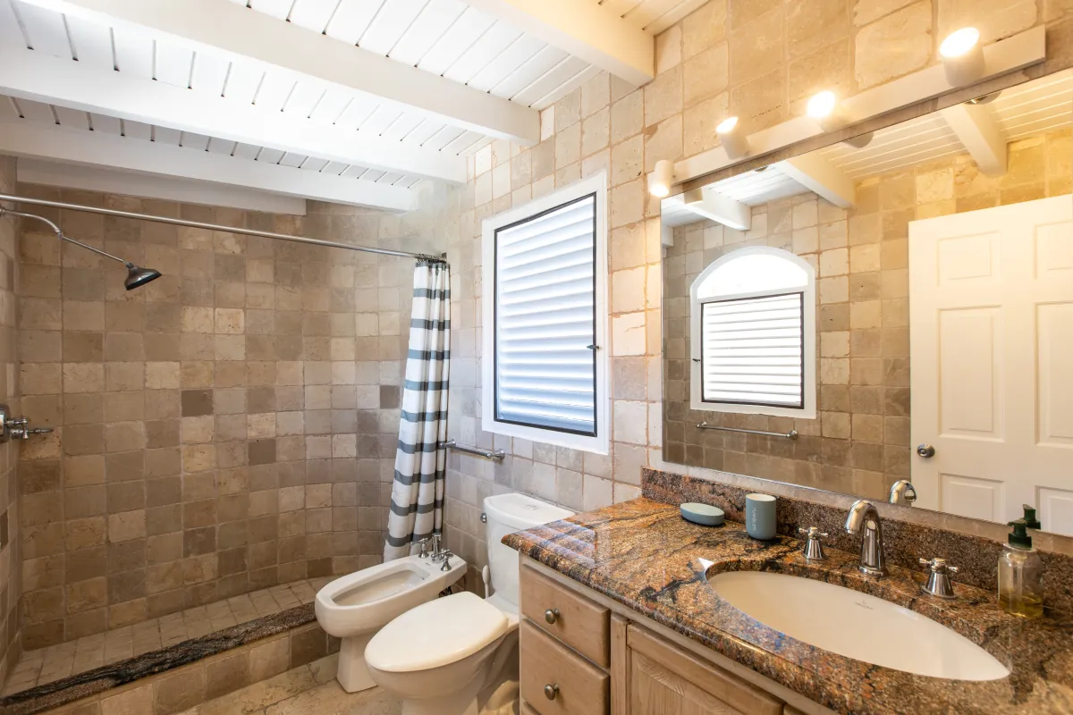 Villa Mongoose Run: Tiled bathroom with walk-in shower granite vanity toilet and bidet