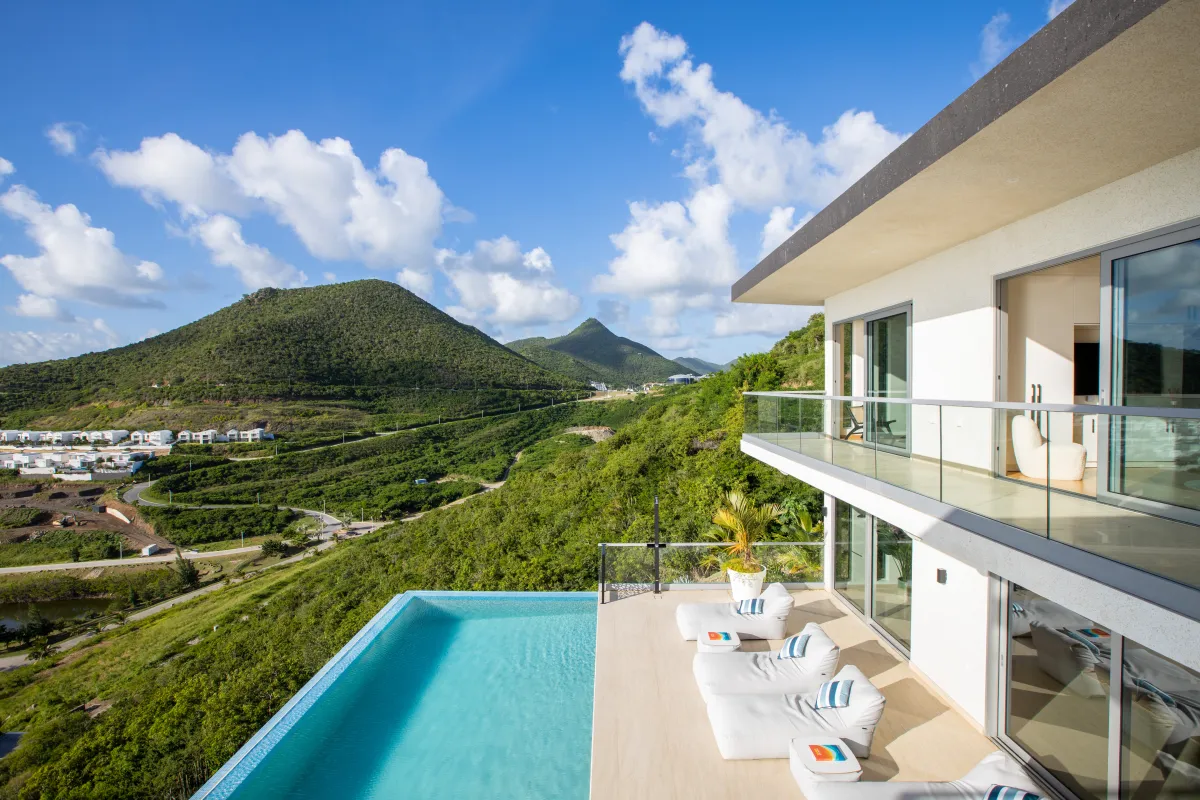 Villa Numa: Infinity pool and sun terrace outside modern hillside villa overlooking green mountains