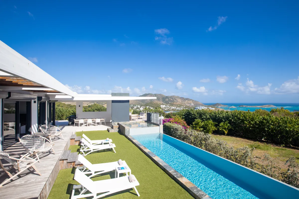 Villa Ocean's One: Lap pool and sun loungers on a terrace overlooking the sea and rolling hills