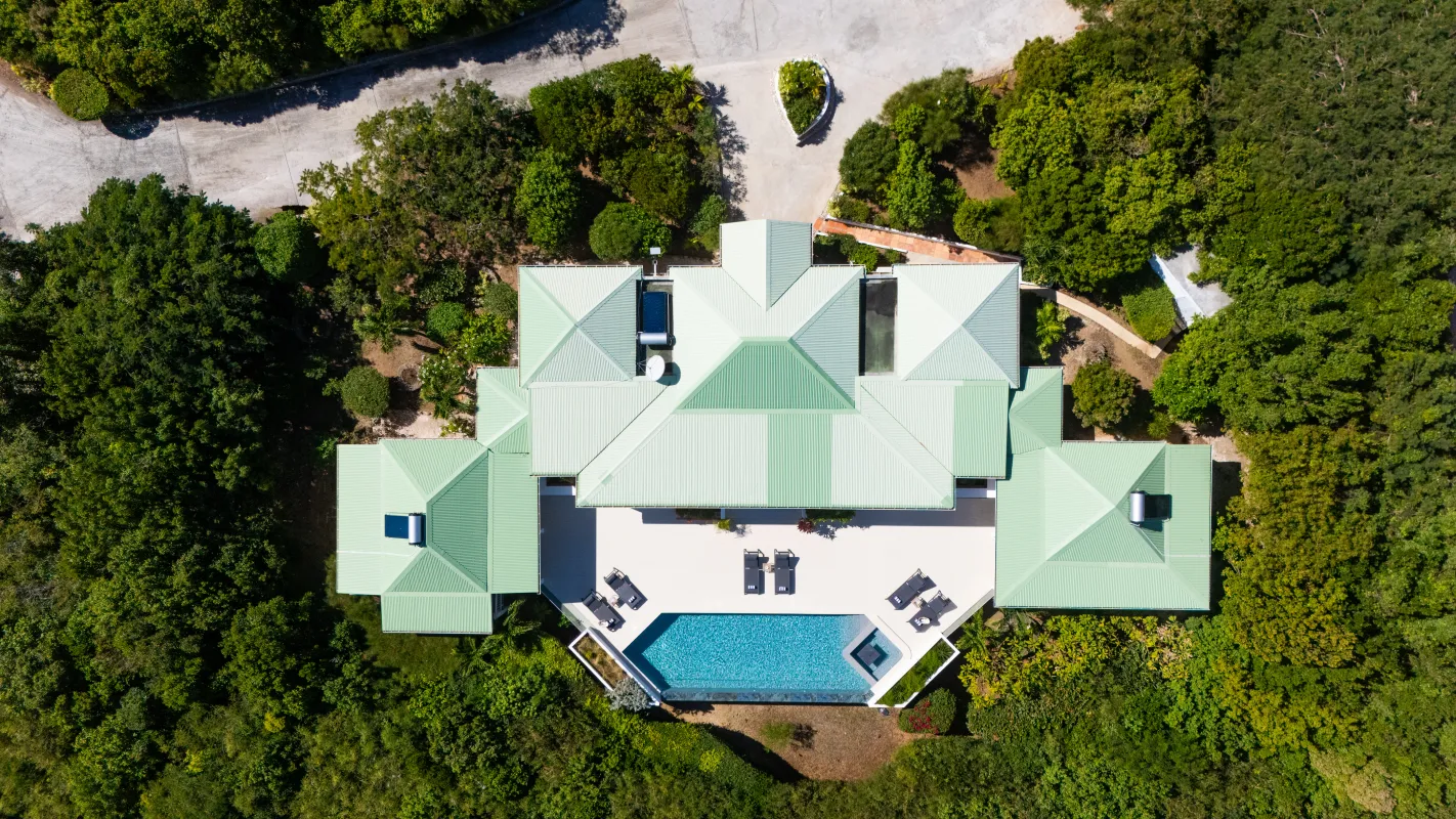 Villa Osun: Top-down aerial view of a villa rooftop, swimming pool terrace, and surrounding greenery